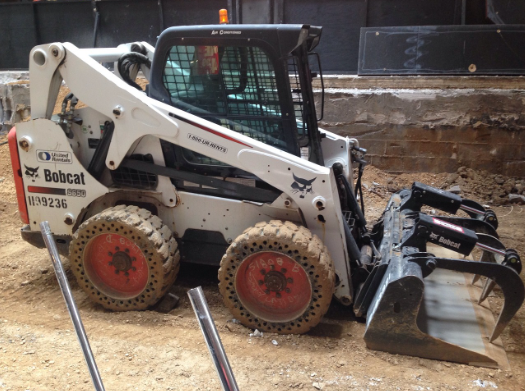 white bobcat skid loader