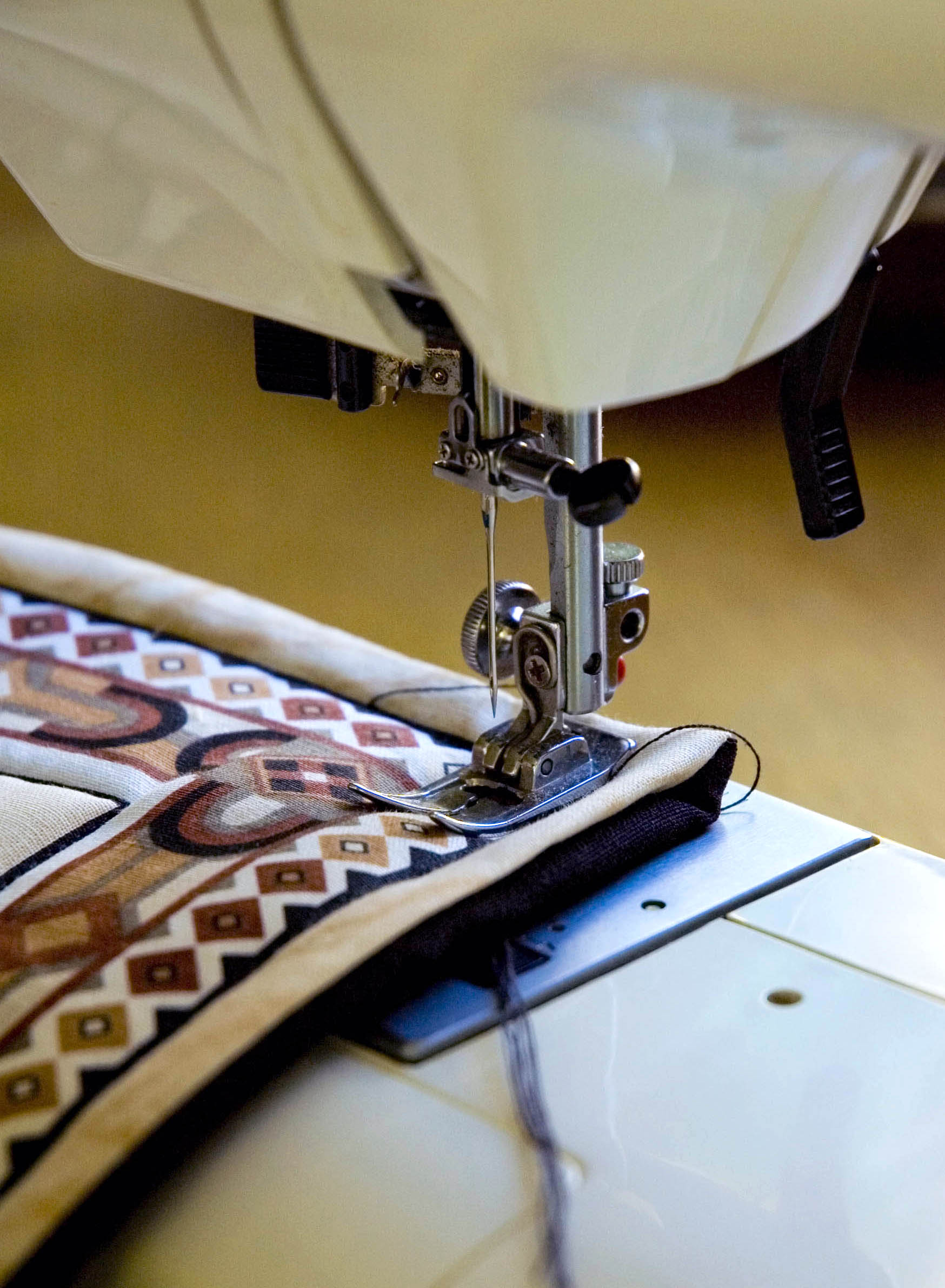 sewing the edge of a quilt