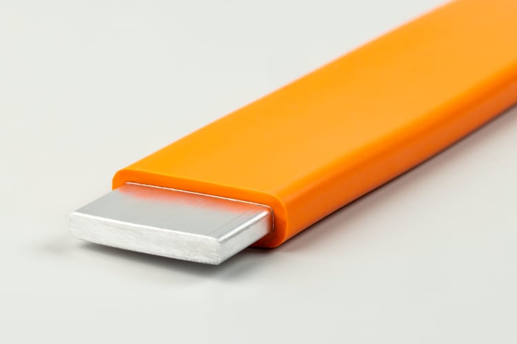 Busbar insulated with ELASTOSIL® R 531/60 (orange). The new silicone rubber ceramifies in the event of a fire. As a result, the rails remain insulated even in the event of an accident or vehicle fire. This provides additional protection to passengers of e