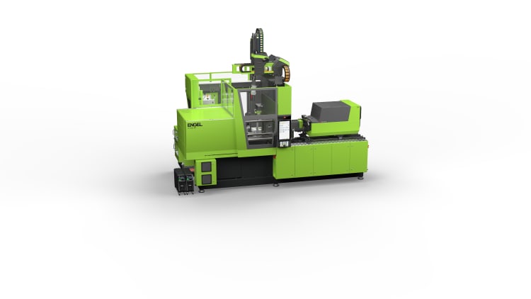 : zdjęcie przedstawia kompaktową zieloną komórkę wtryskową ENGEL z automatyzacją poprzez robota liniowego