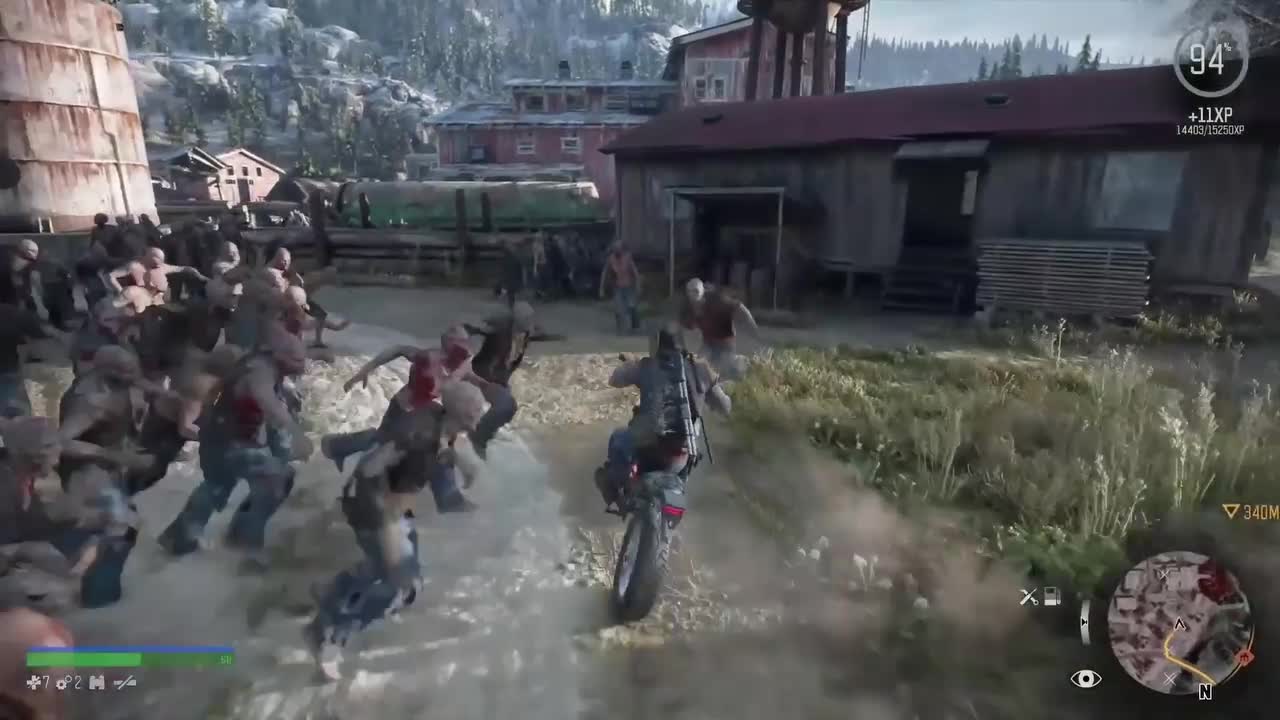 Days Gone главный герой едет на мотоцикле от зомби