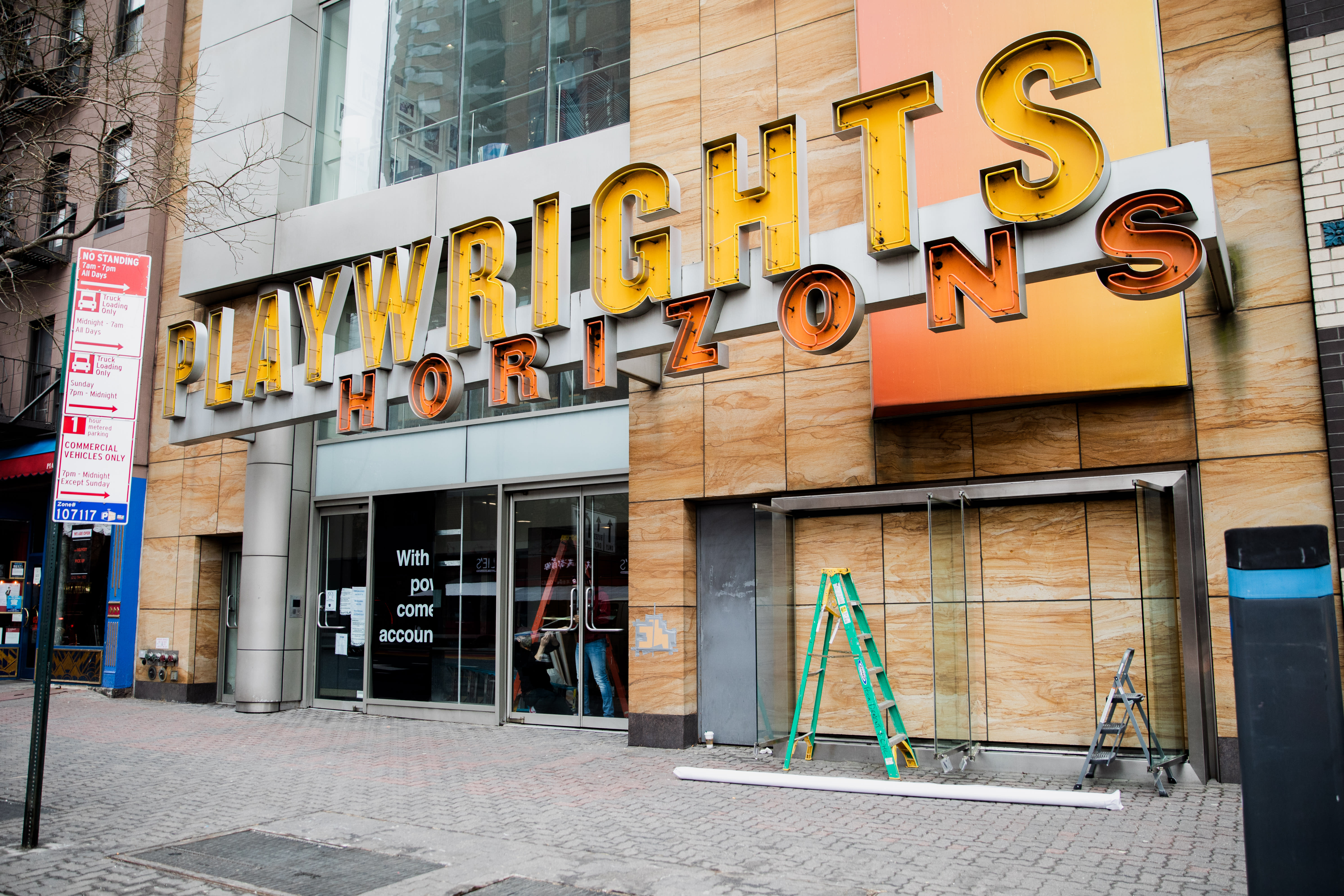 Image of an early 20th century soldier, crouching while wearing a gas mask, is pasted over the right side of an American Eagle ad. On the left side the same ad, a young male model crouches in front of a scenic road on the highway.