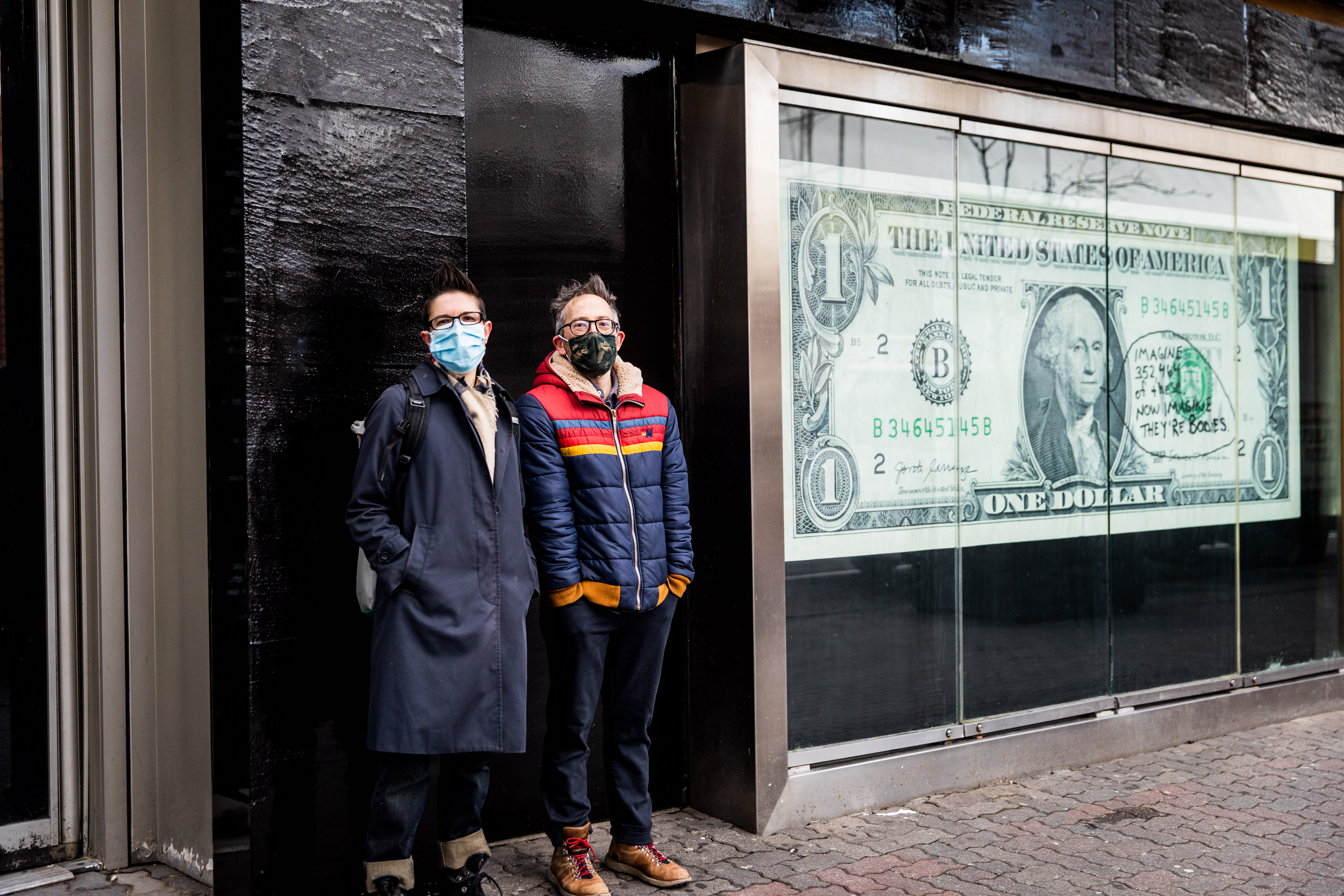 Image of an early 20th century soldier, crouching while wearing a gas mask, is pasted over the right side of an American Eagle ad. On the left side the same ad, a young male model crouches in front of a scenic road on the highway.