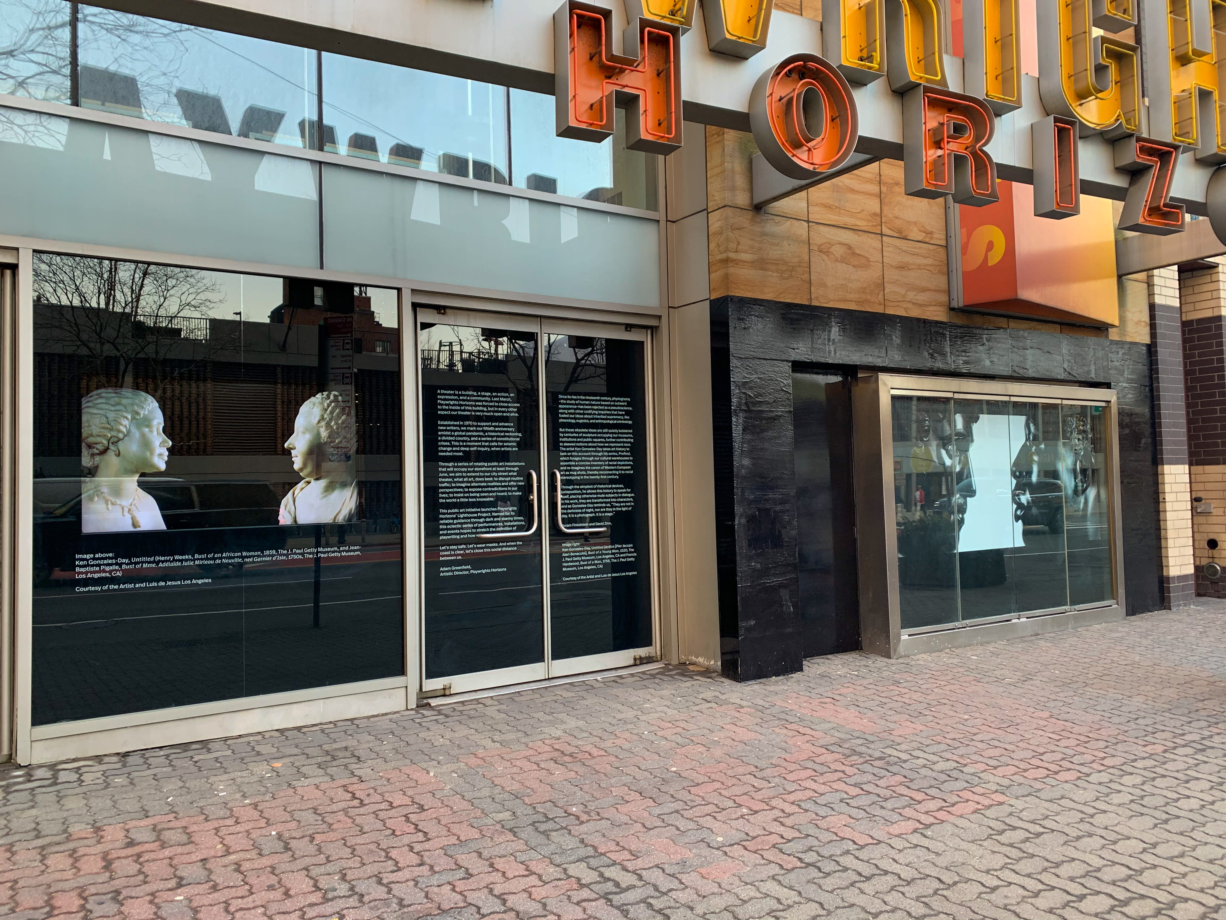 Image of an early 20th century soldier, crouching while wearing a gas mask, is pasted over the right side of an American Eagle ad. On the left side the same ad, a young male model crouches in front of a scenic road on the highway.