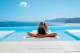 Santorini Woman in Infinity pool, Santorini, Greece