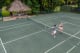 Couples Swept Away Tennis Court