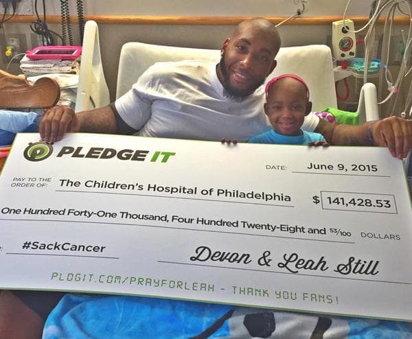 Devon Still presents check from earned pledges