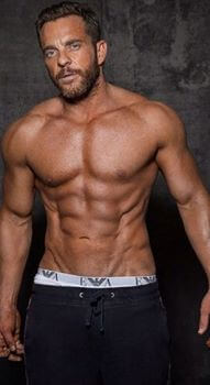 an image of a man posing withoot a top on