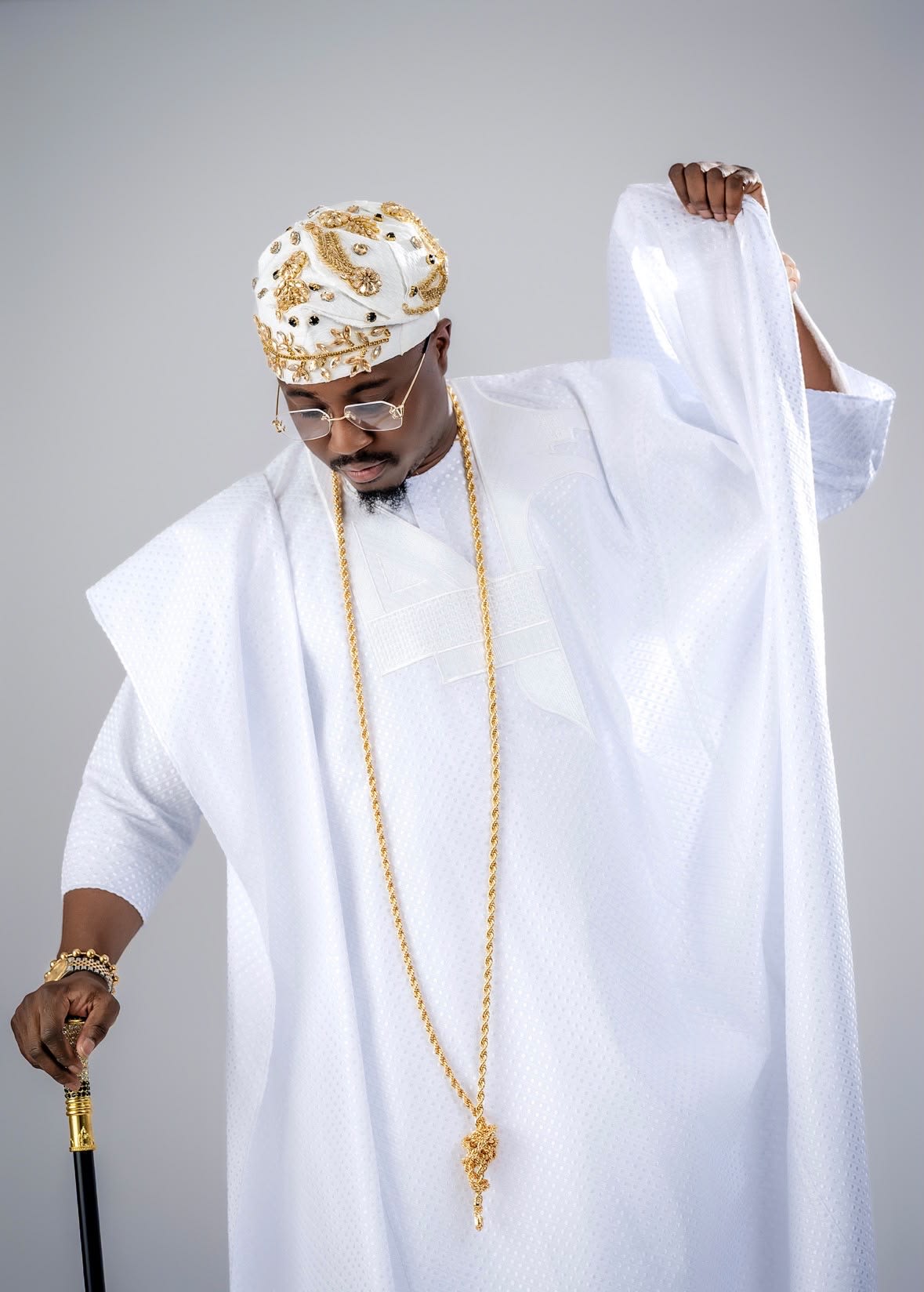 Royal Crown Fila worn with a white agbada, campaign portrait