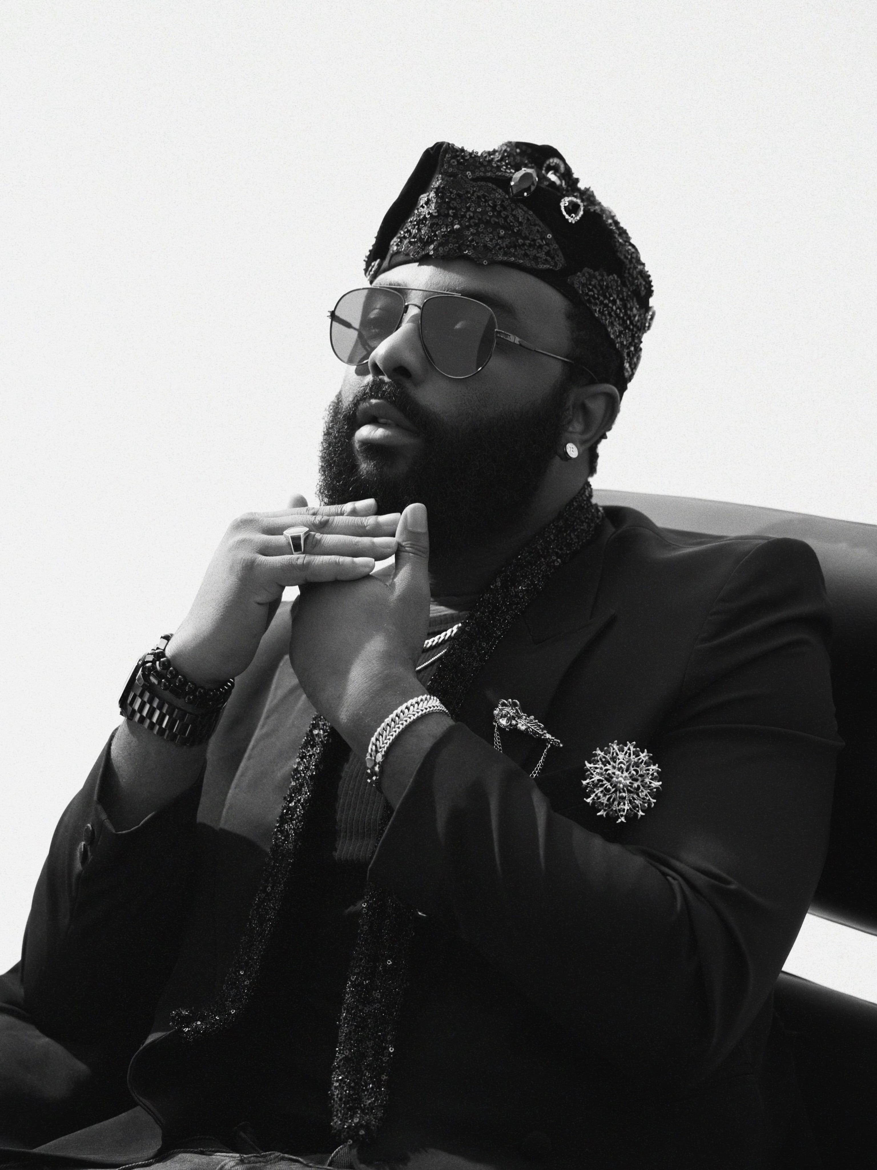 Black Beaded Fila, worn, seated portrait