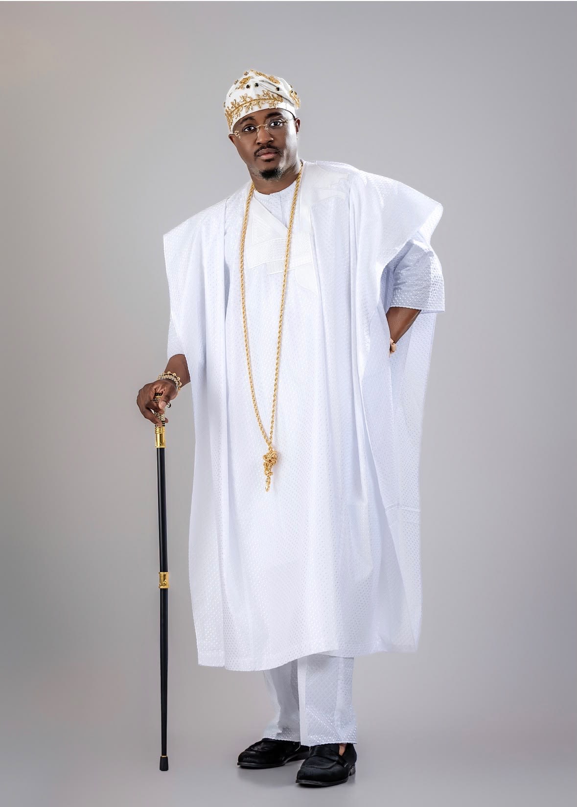 Royal Crown Fila worn with a white agbada, front view