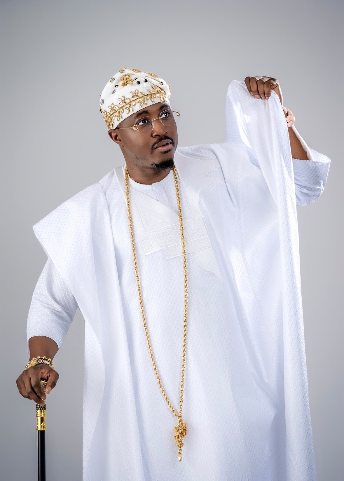Royal Crown Fila worn with a white agbada, close portrait