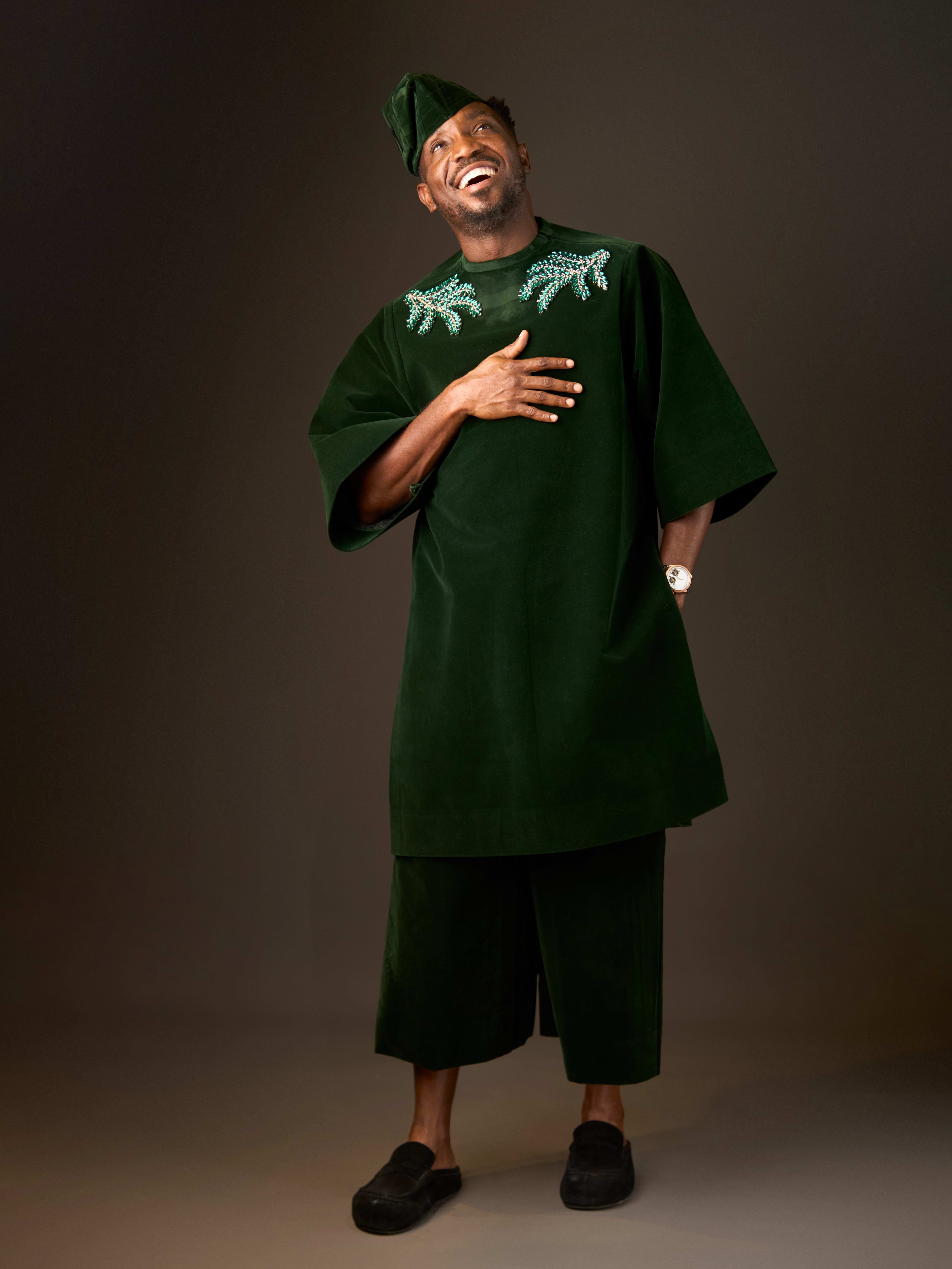 Emerald Sovereign, full look with sculpted cap, laughing