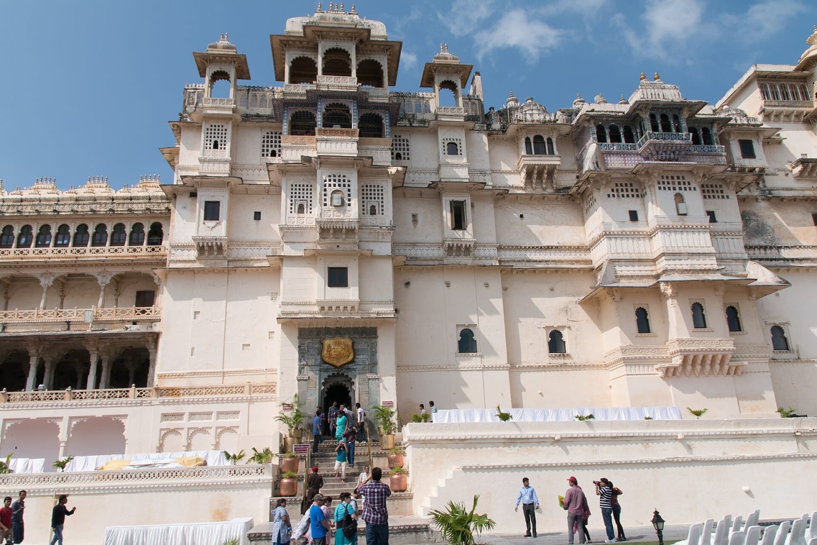 The pale façade of the City Palace, Udaipur, above the lake
