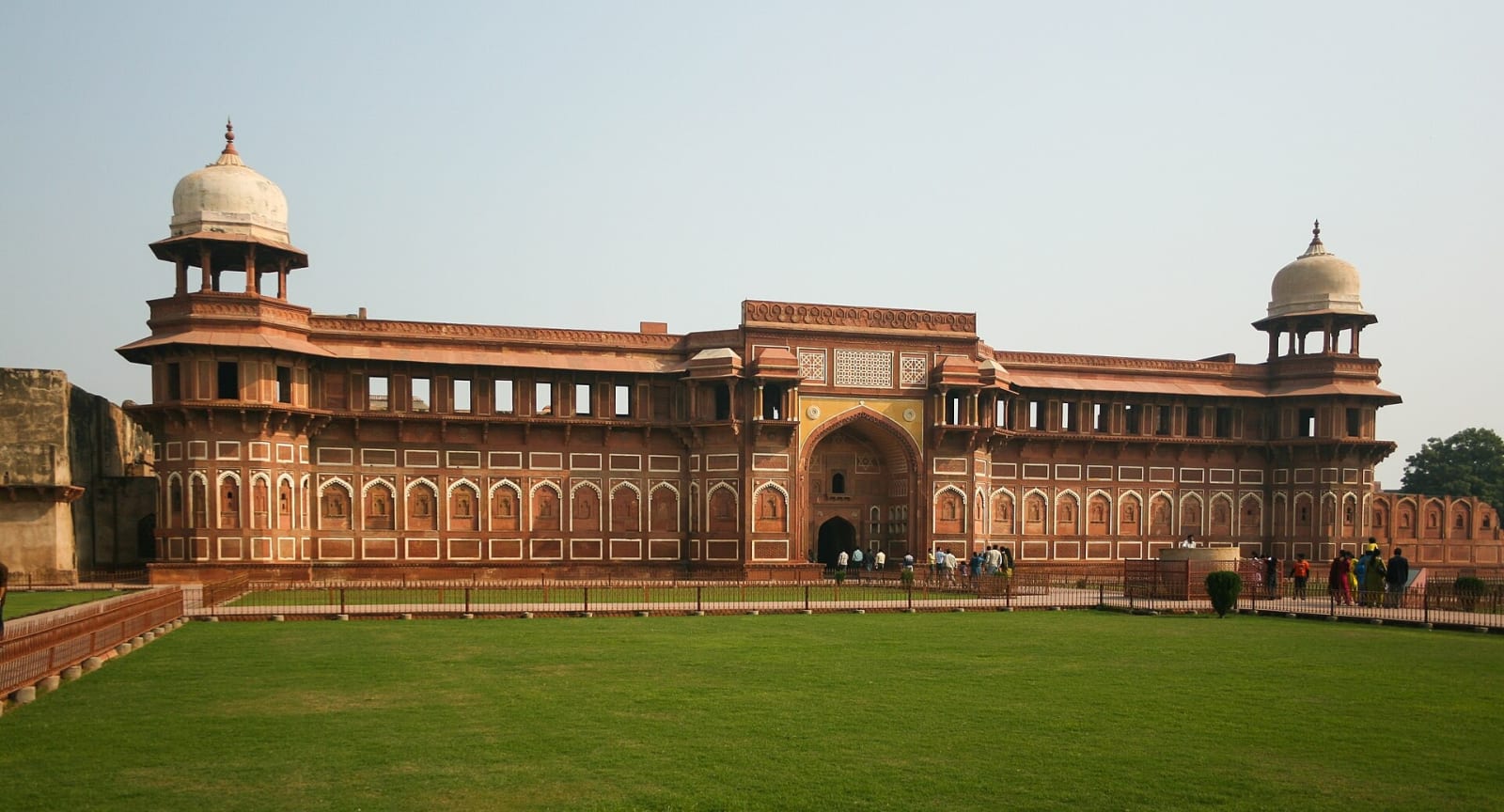 The red sandstone Jahangiri Mahal beside a lawn inside Agra Fort