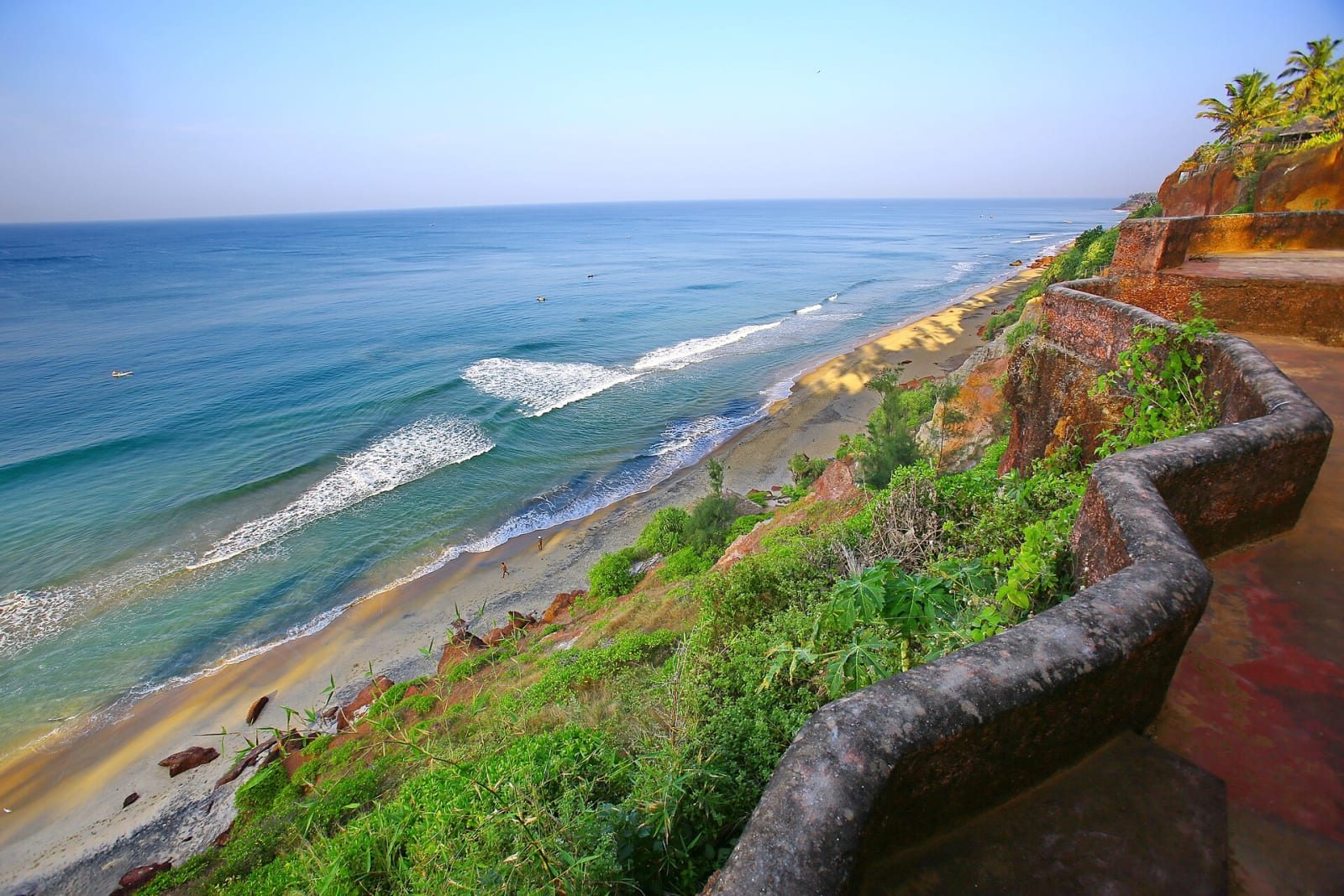 A low wall along the cliff-top path above the sea at Varkala