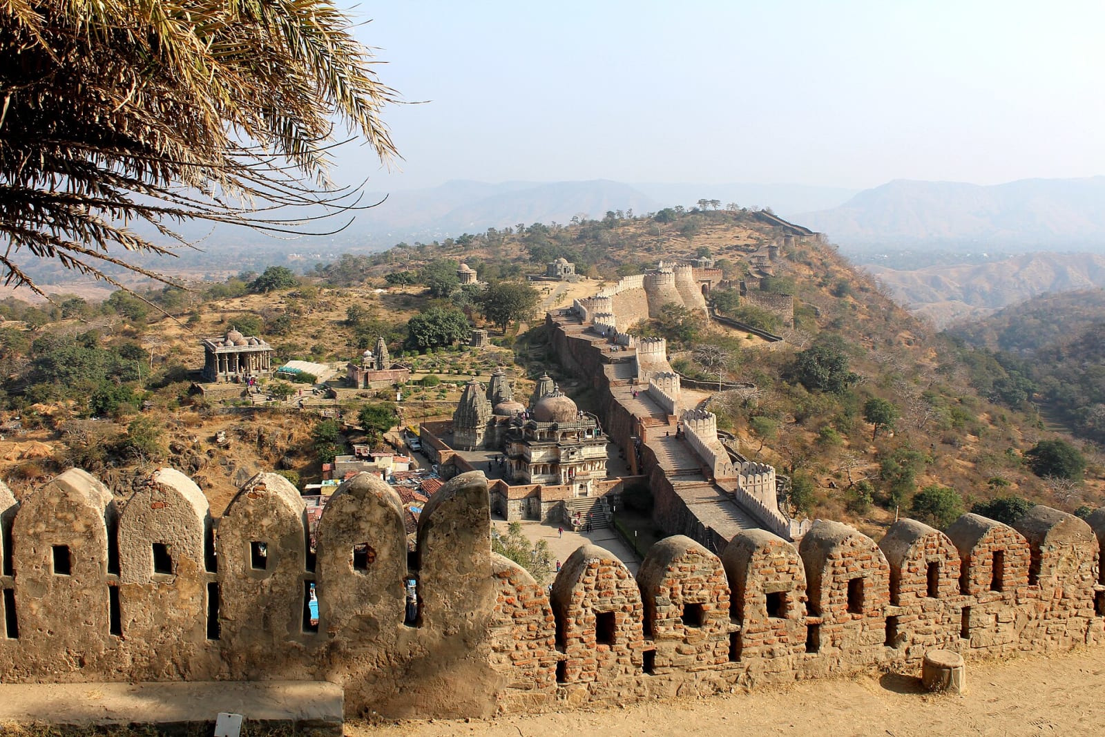 Crenellated fort wall and temple spires on the ridge at Kumbhalgarh Fort