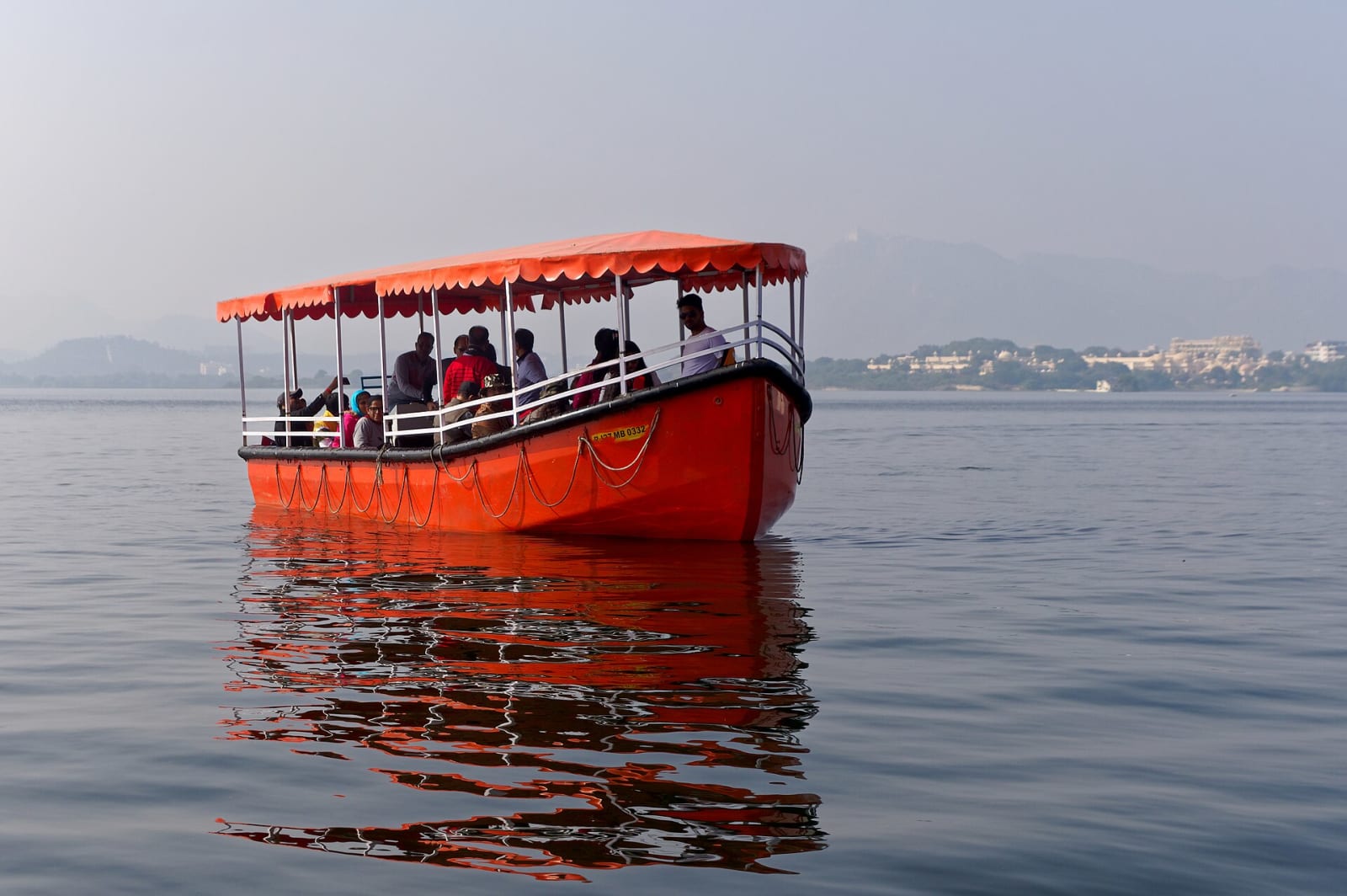 A red boat on Lake Pichola in Udaipur