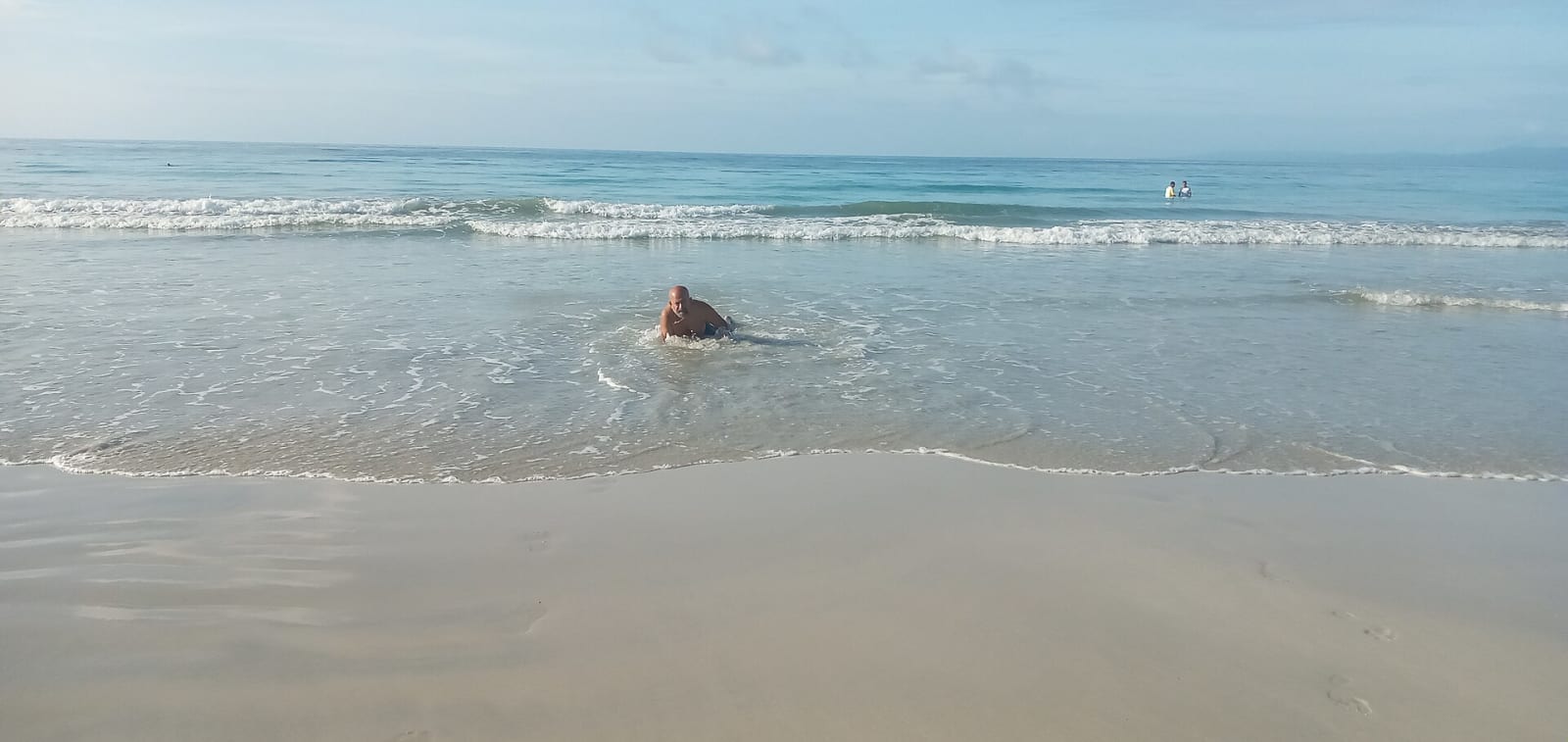 Gentle surf on the pale sand of Radhanagar Beach, Havelock Island, in the morning