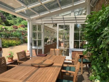 MS - Transparent Solar Glass Canopy over a outdoor dining area