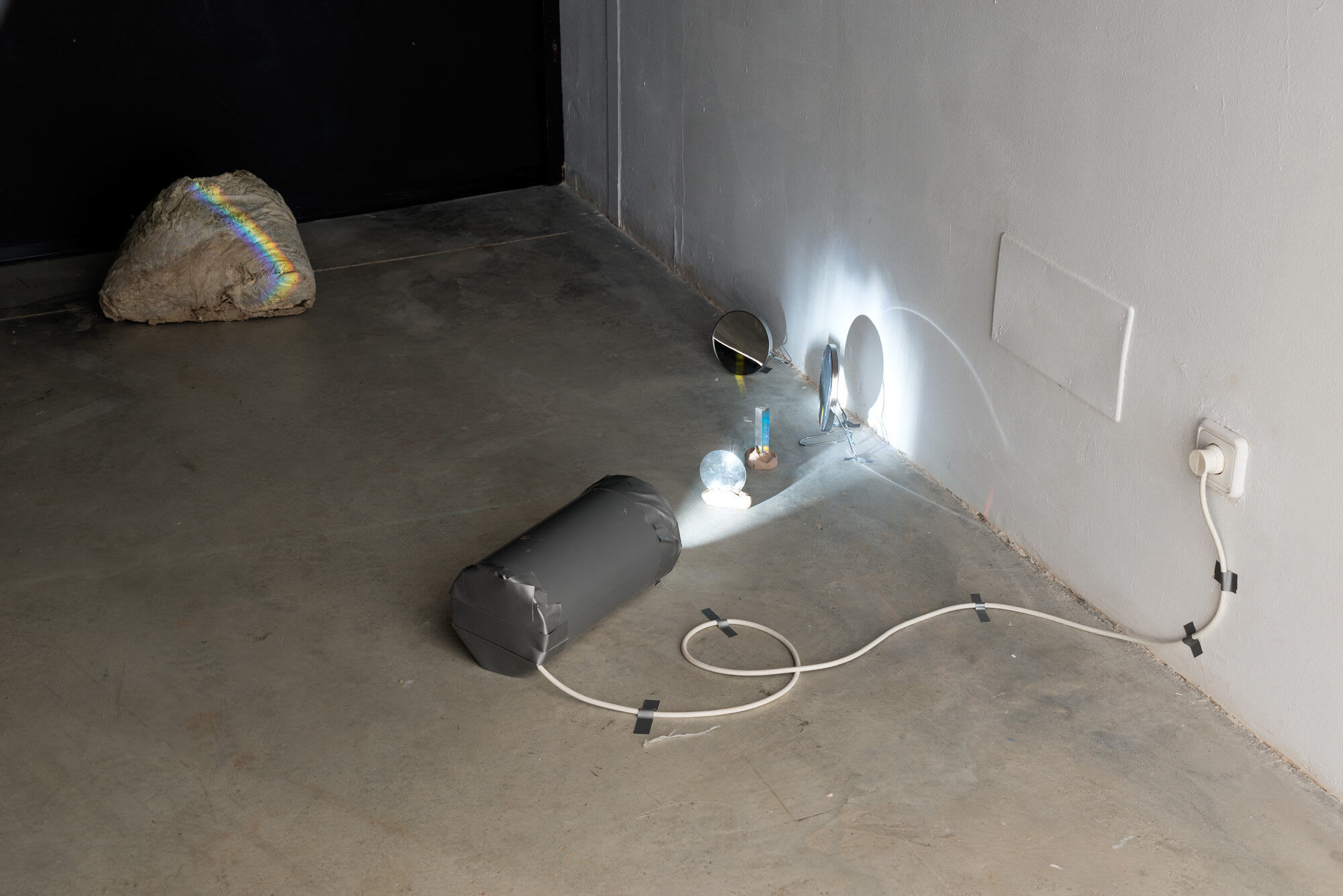 Everything Desires Existence, 2019, concrete human fossile, glas, light