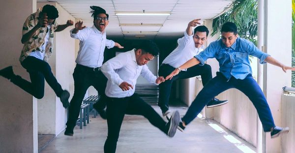 Happy employees jumping with joy.