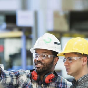 employees talking in a warehouse