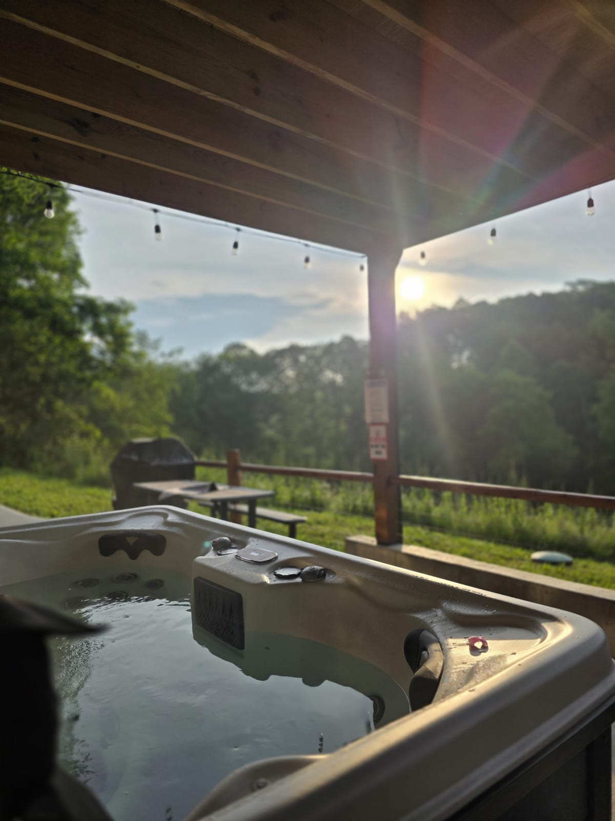 Private outdoor hot tub at Pool House Lodge — Hocking Hills Ohio