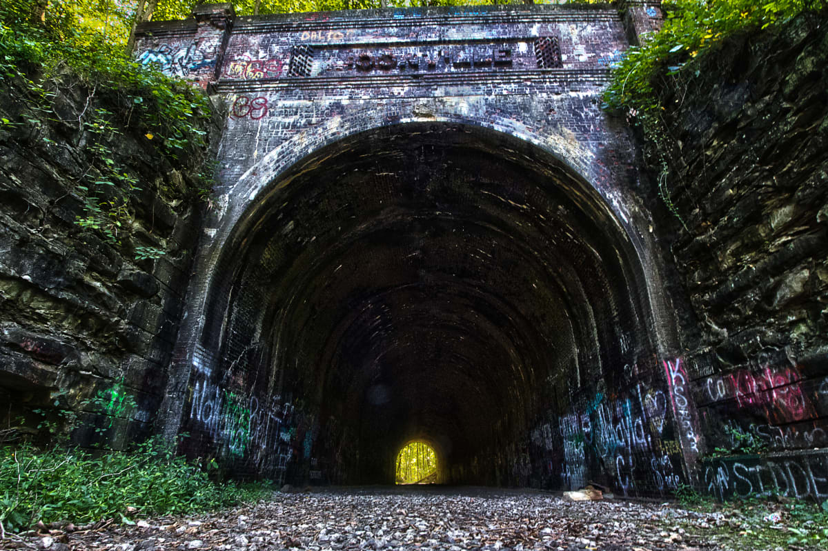 Moonville Rail Trail through fall forest in Hocking Hills Ohio