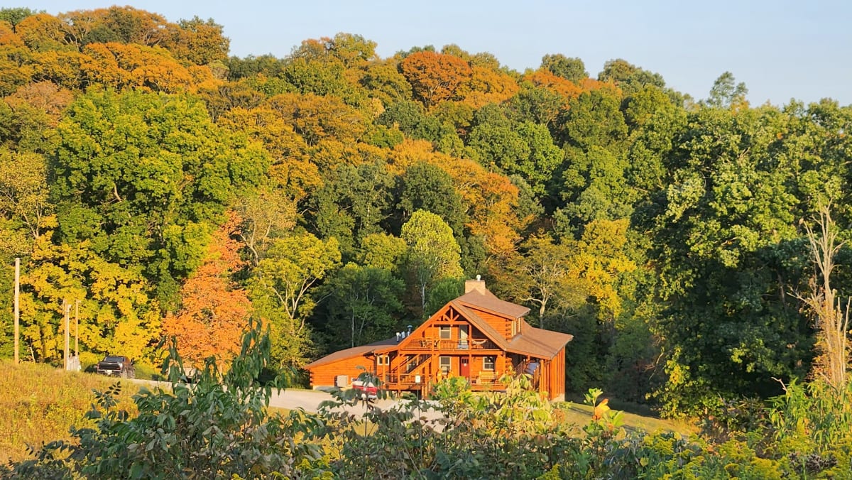 Pool House Lodge exterior surrounded by fall foliage in Hocking Hills Southern Region Ohio