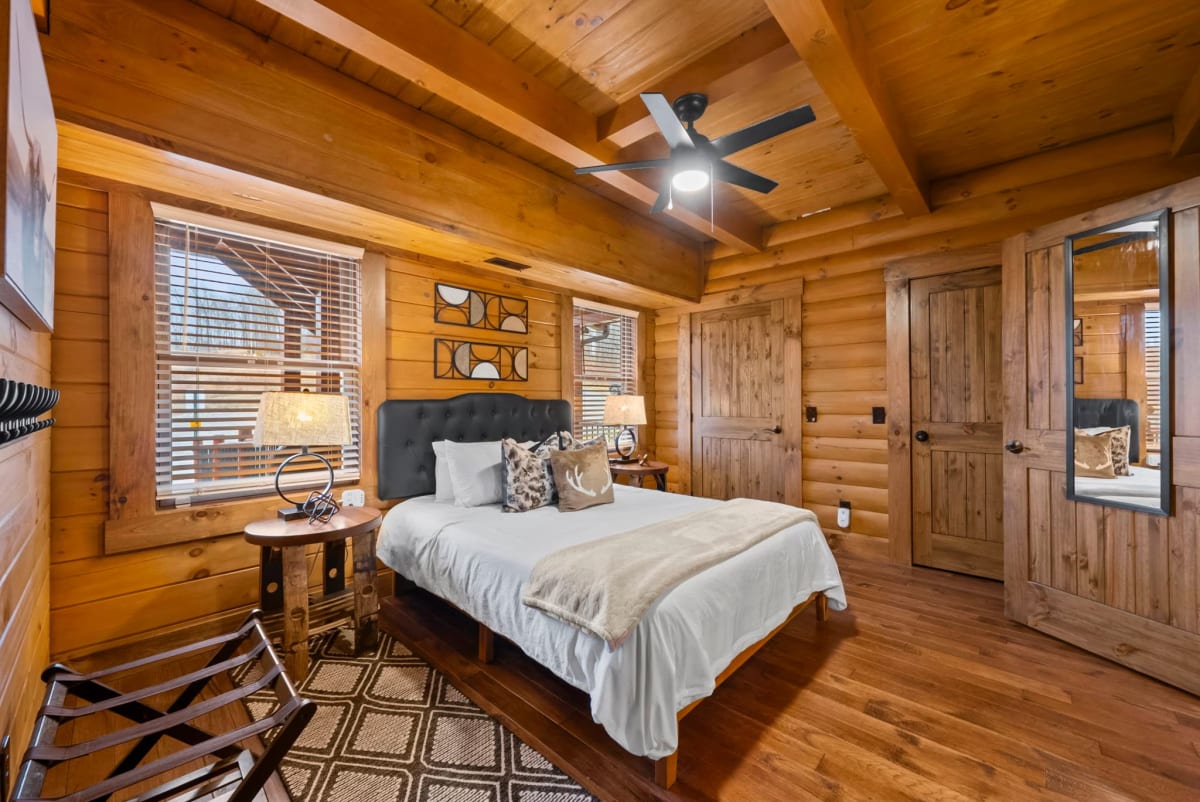 Queen suite bedroom at Pool House Lodge — multigenerational cabin in Hocking Hills Ohio