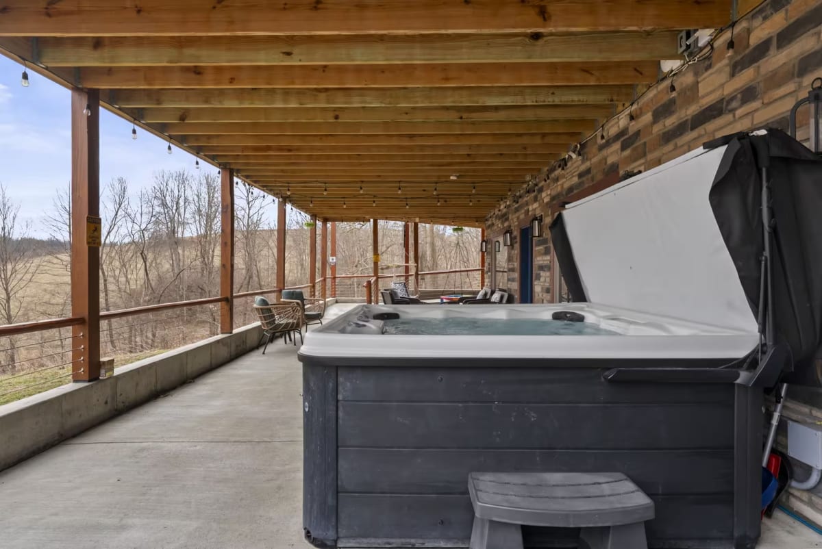 8-person hot tub on lower patio at Pool House Lodge Hocking Hills