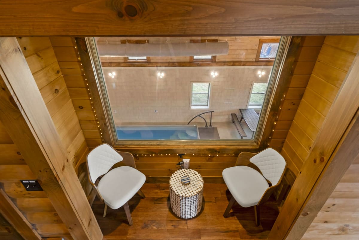 Overhead view of the pool viewing nook at Pool House Lodge — window seat overlooking the private indoor pool, Hocking Hills Ohio