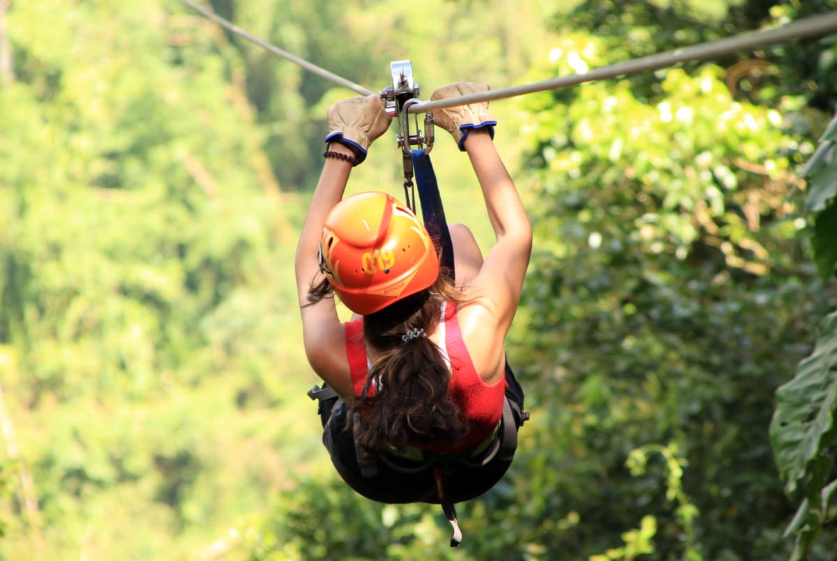 Zip lining through the fall foliage canopy in Hocking Hills Ohio