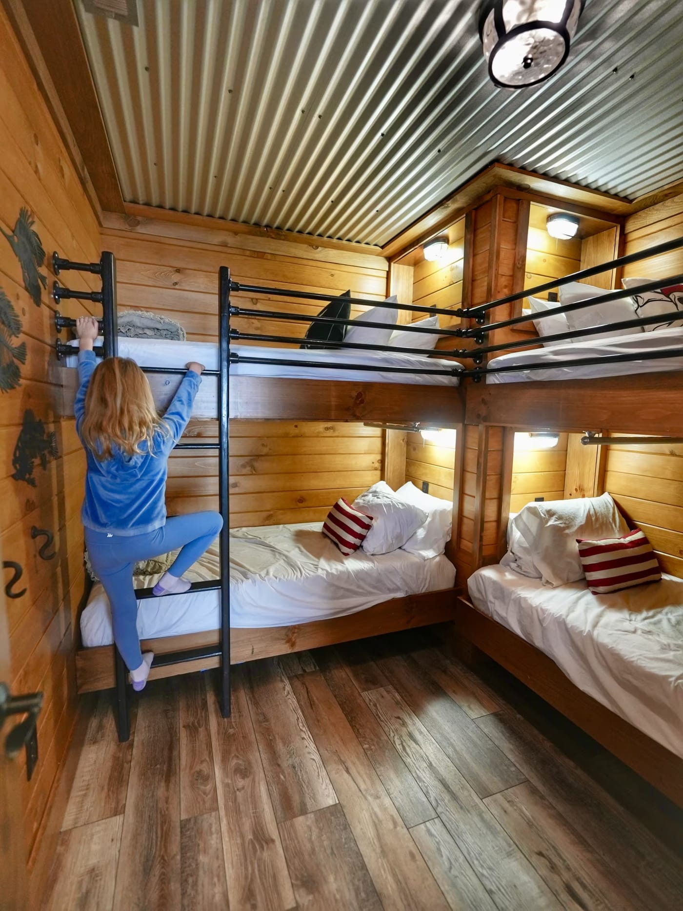 Girl climbing into the pirate bunk room at Pool House Lodge Hocking Hills Ohio