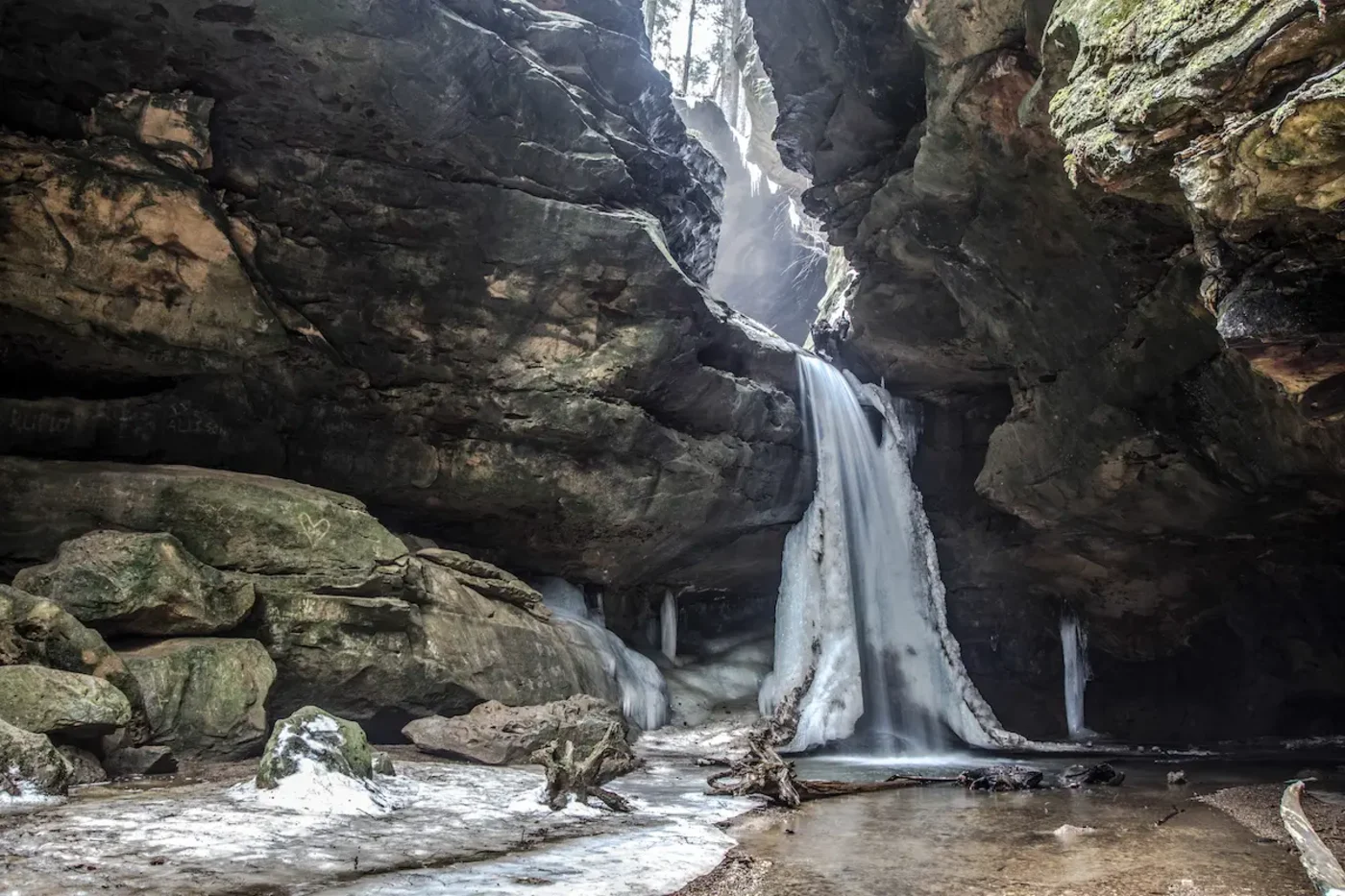 A frozen waterfall inside a rock grotto in Hocking Hills, January
