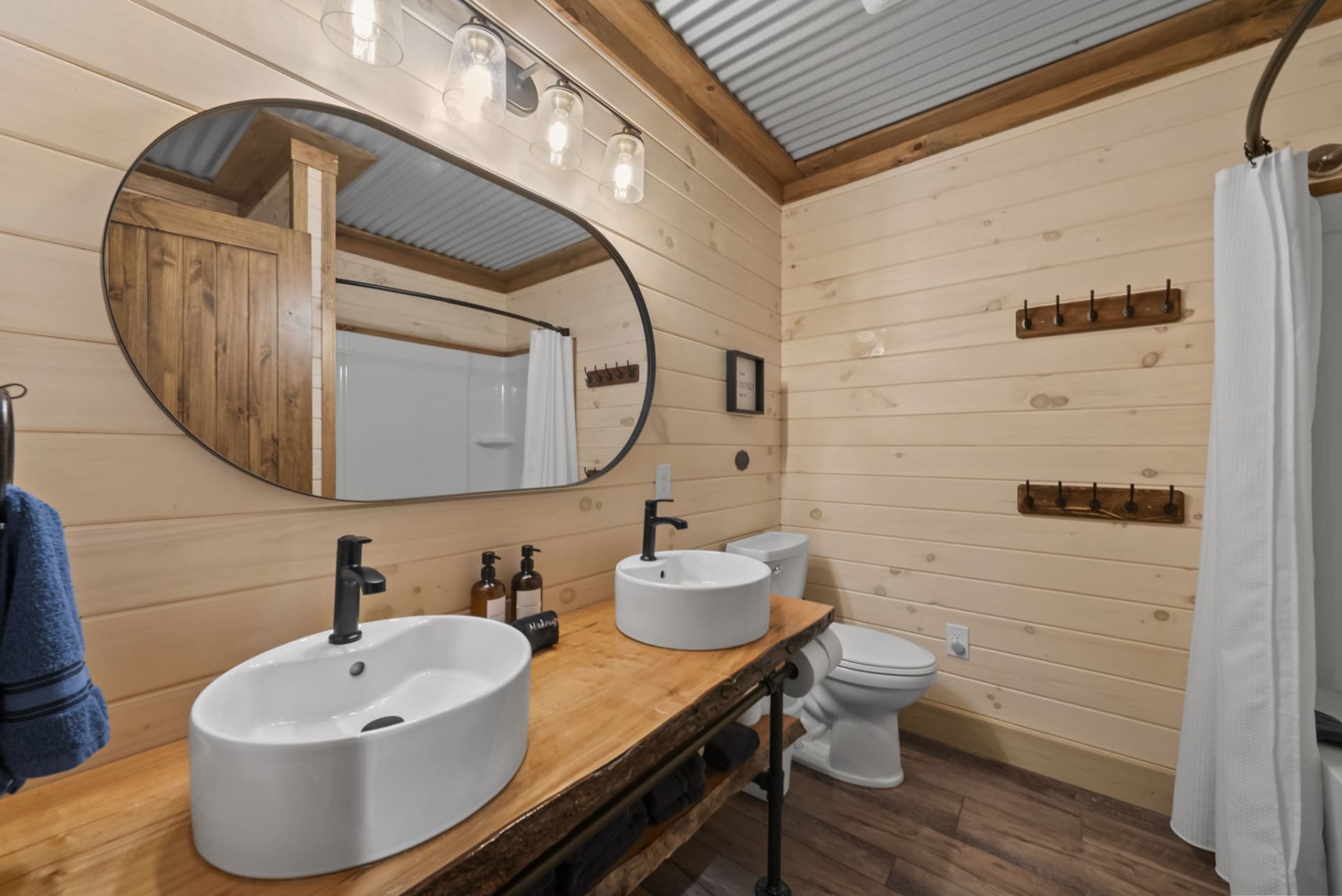 Lower level hallway bathroom at Pool House Lodge