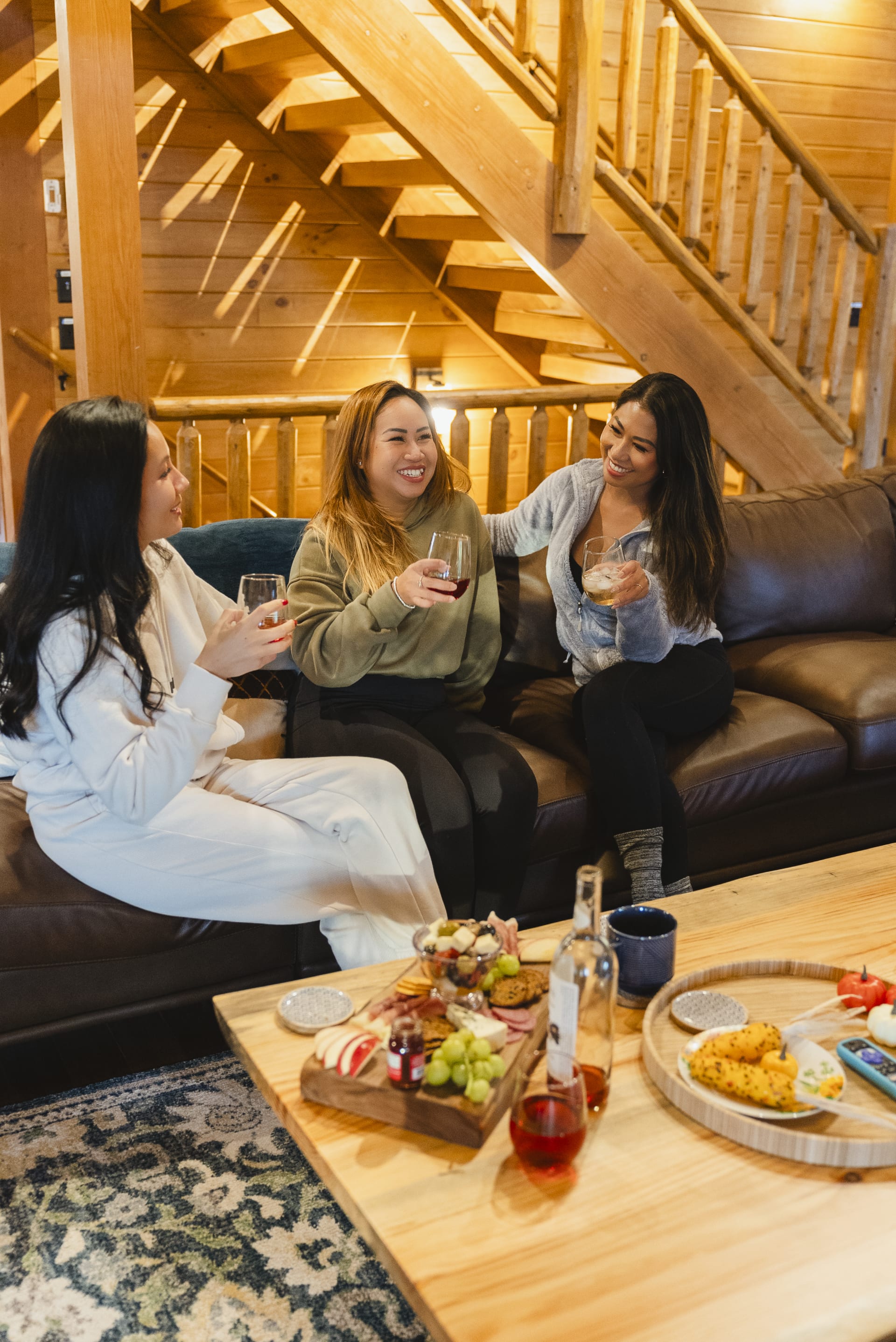 Guests laughing and relaxing at Pool House Lodge
