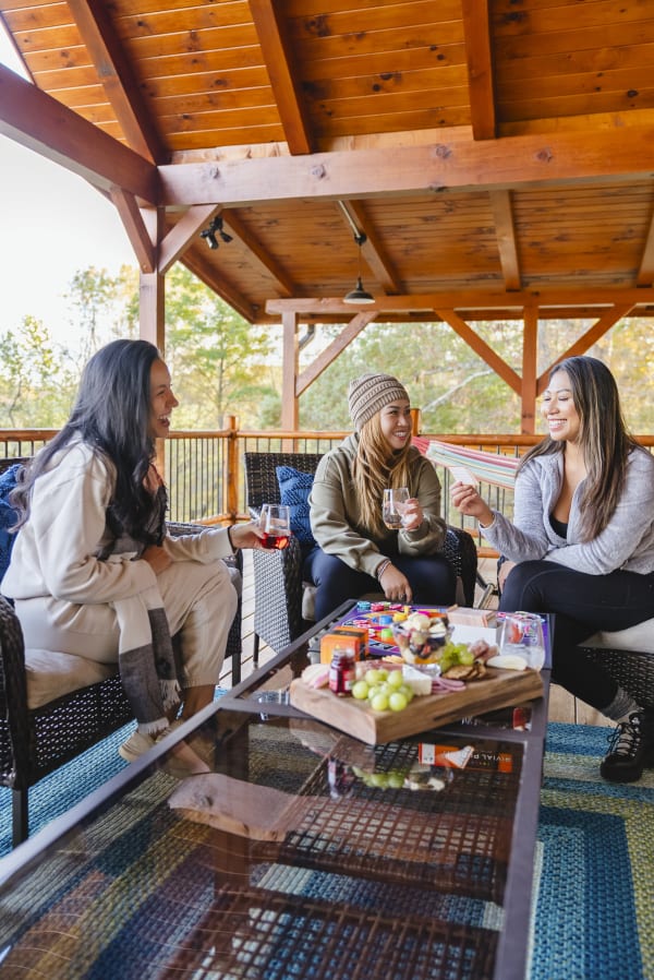 Relaxing at Pool House Lodge covered porch