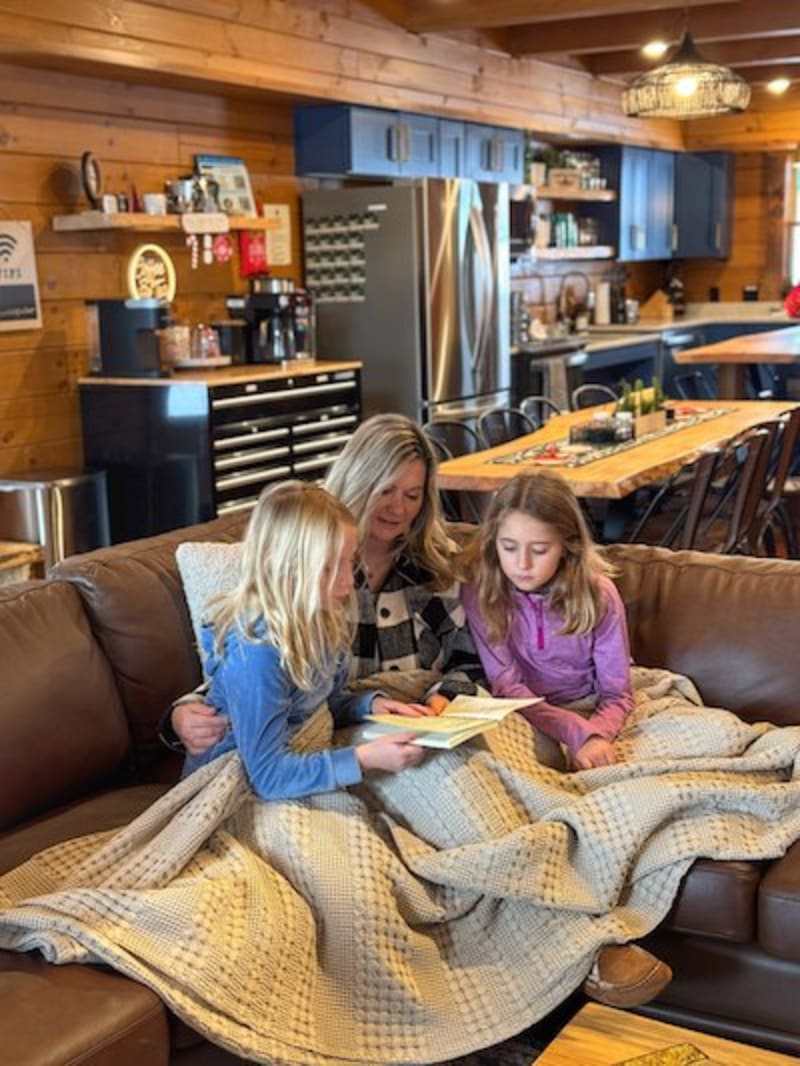 Inside Pool House Mom reading to kids 1