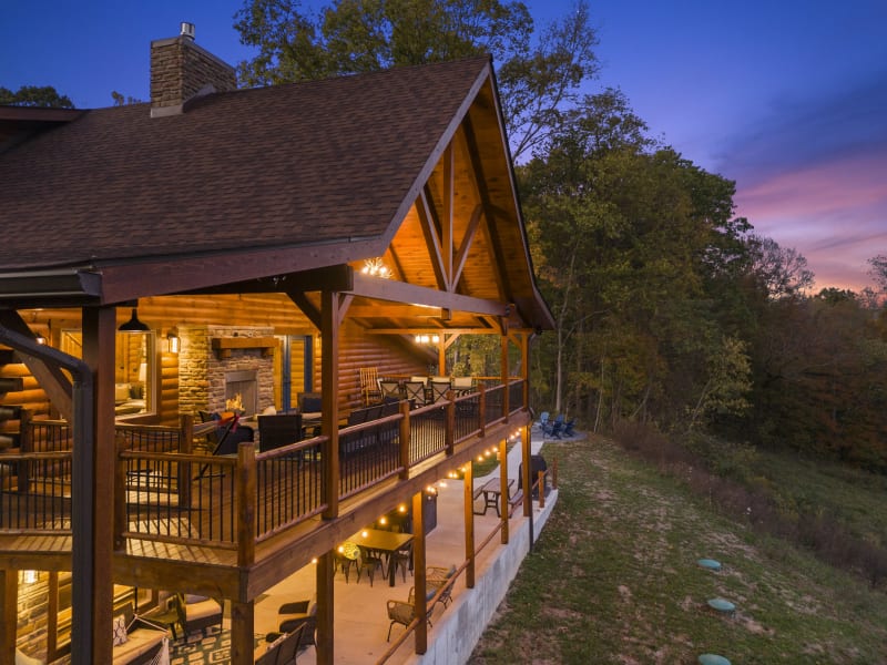 Pool house lodge aerial drone upper deck fireplace dusk
