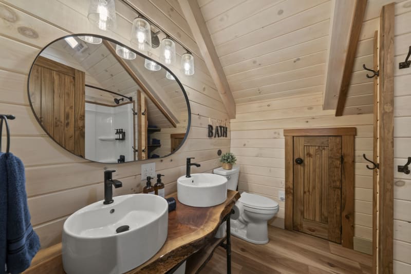 Pool house lodge bathroom1 double vessel sinks wood vanity