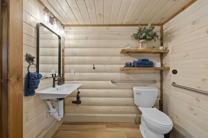 Pool house lodge bathroom2 pedestal sink blue towels