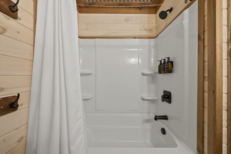 Pool house lodge bathroom5 tub shower black fixtures