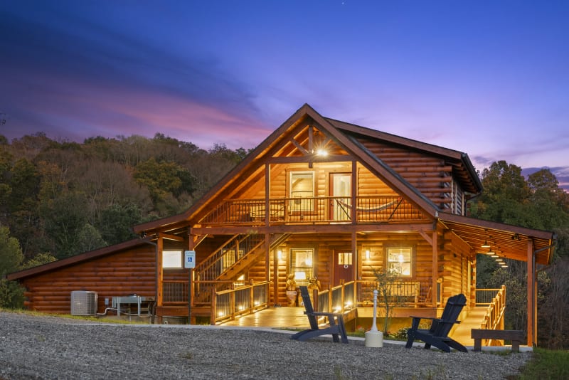 Pool house lodge cabin exterior dusk fall foliage wide angle