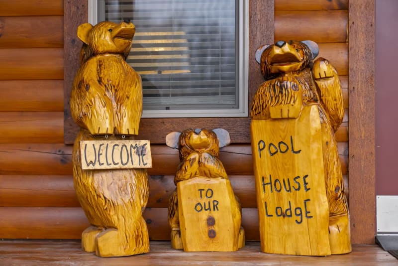 Pool house lodge carved bear welcome sign cabin entrance