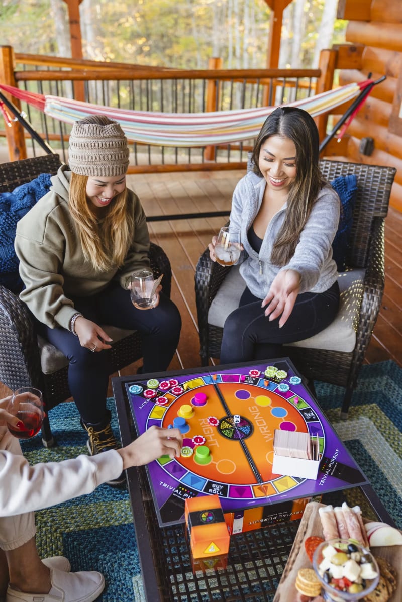 Pool house lodge deck board game trivial pursuit hammock