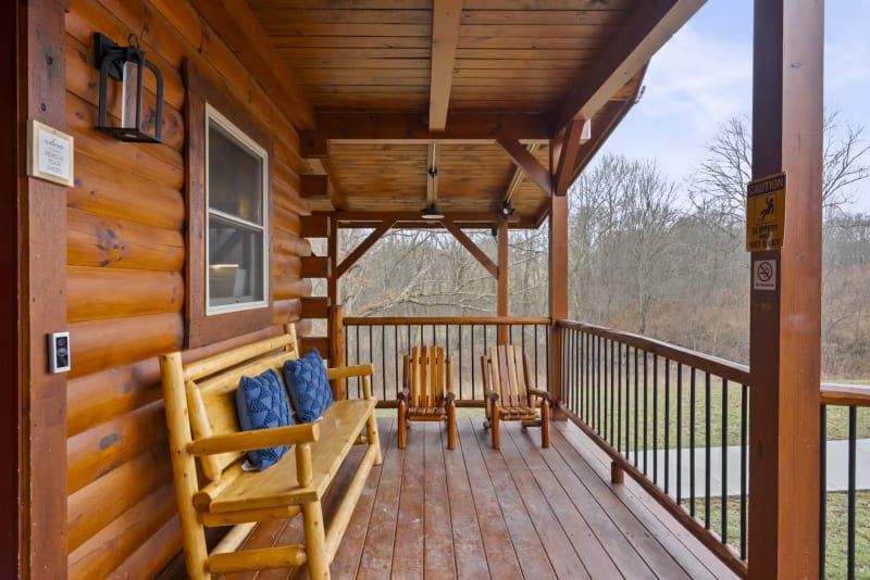 Pool house lodge front porch log bench rocking chairs