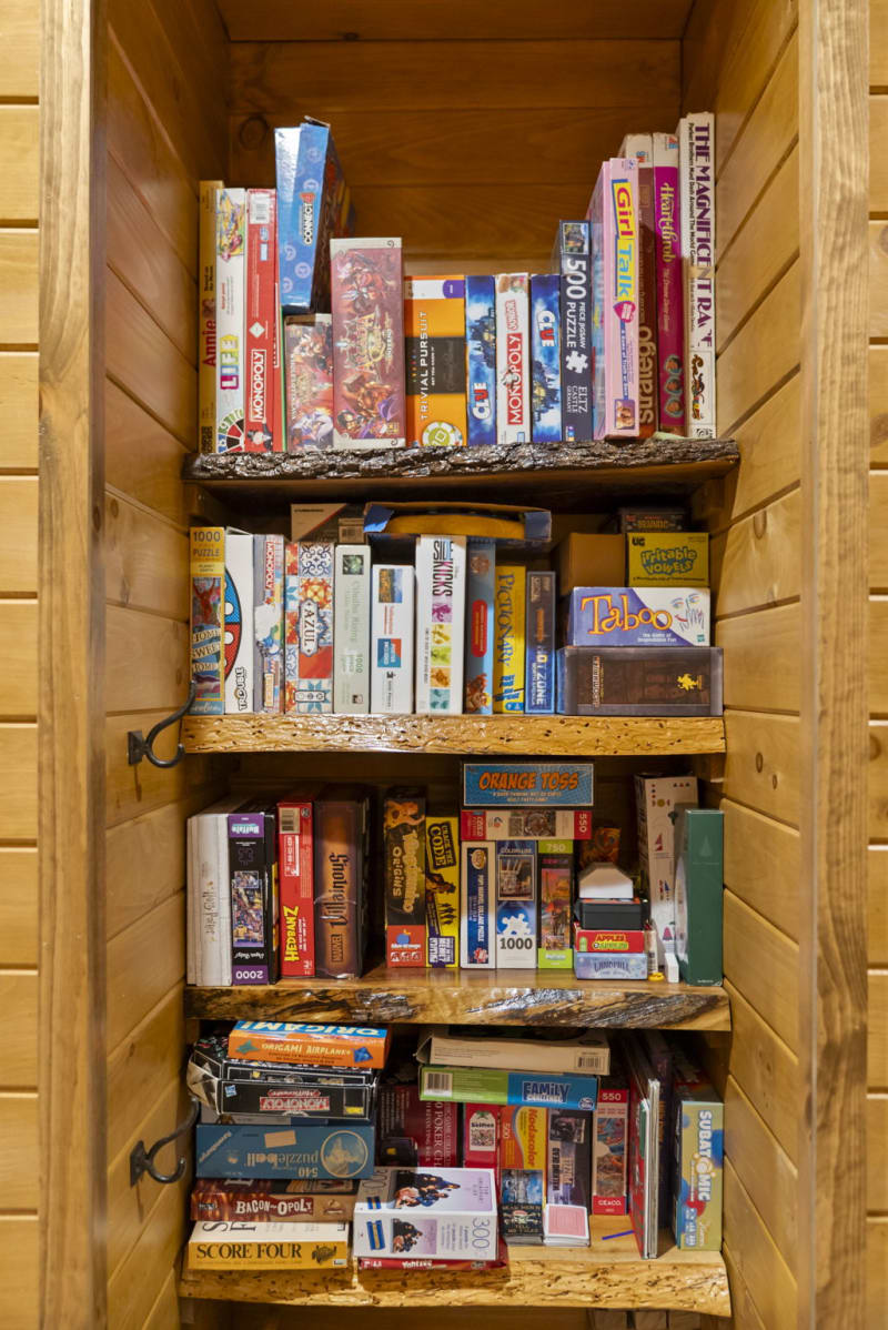 Pool house lodge game room board games shelves closeup