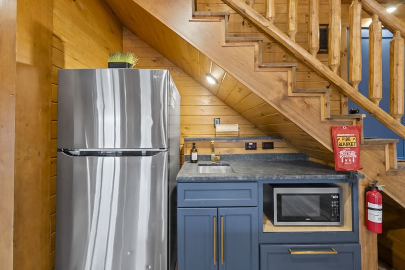 Pool house lodge game room kitchenette fridge microwave under stairs